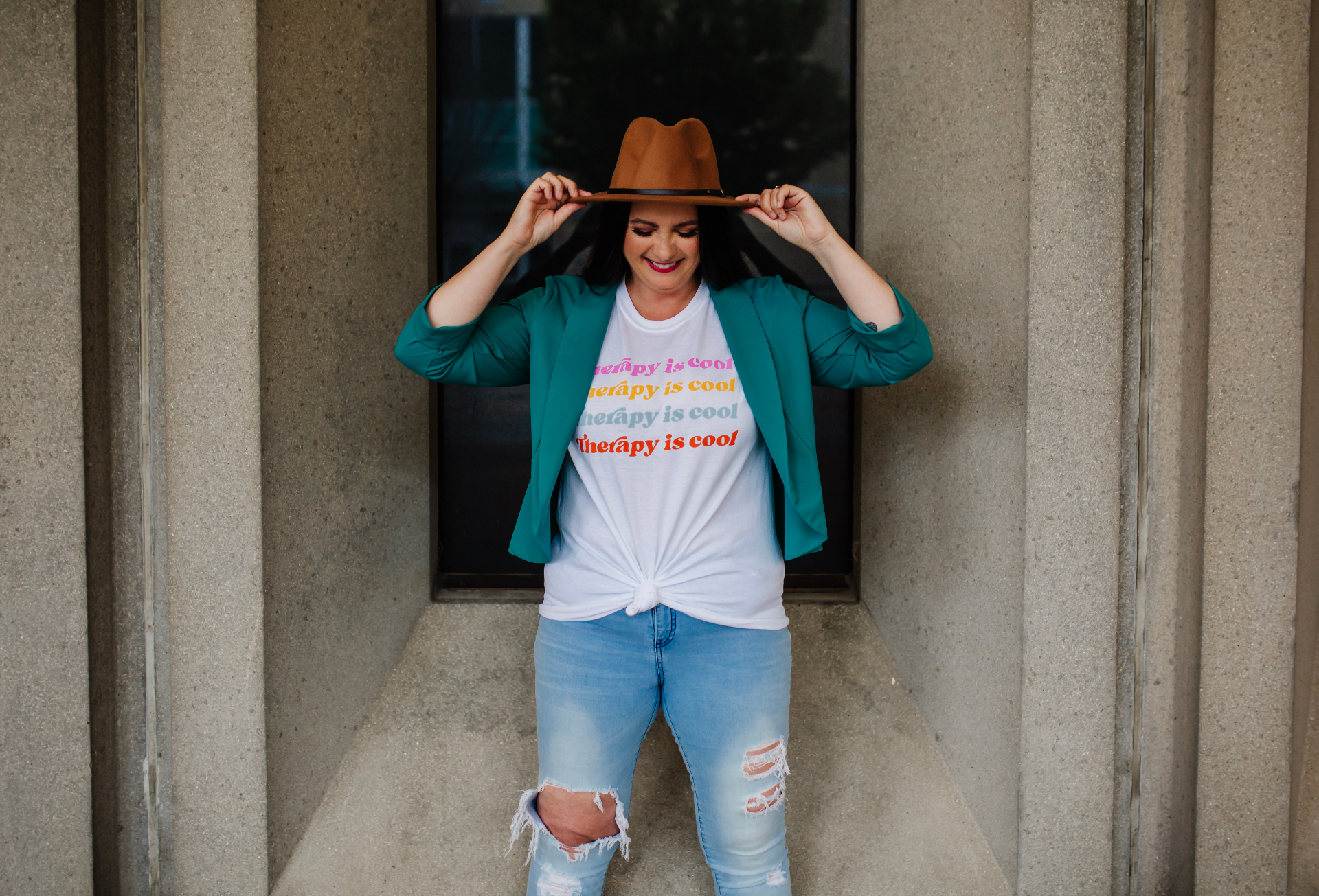 Karri Wright, Registered Holistic Nutritionist, smiling in a teal blazer